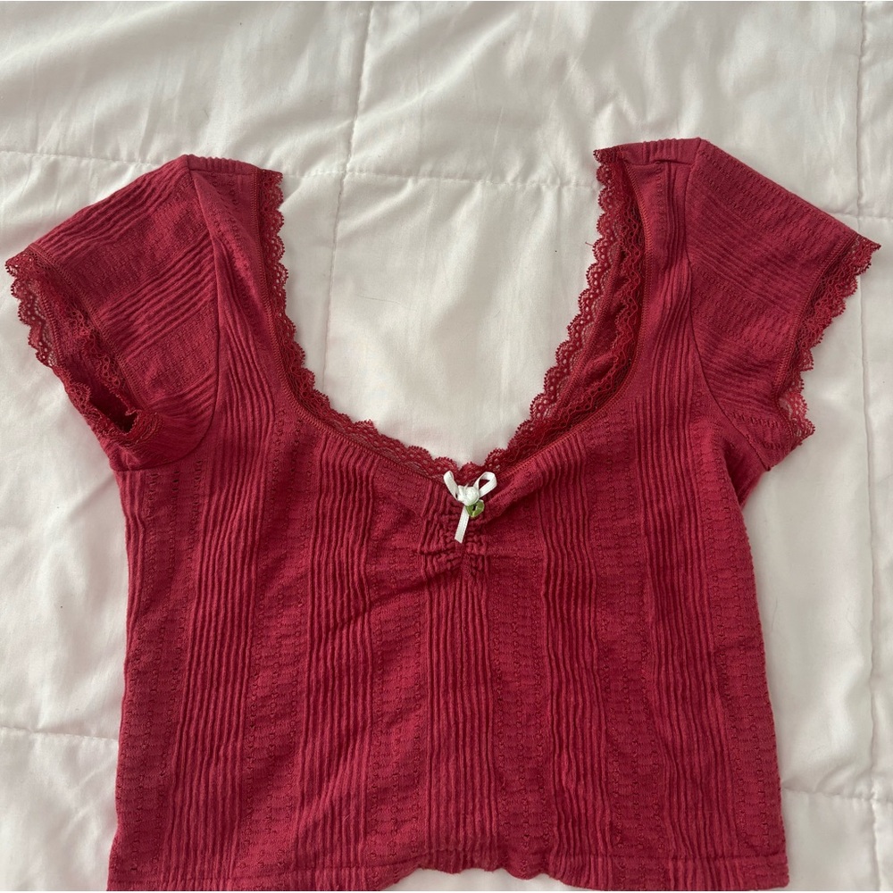 Out From Under red shirt.